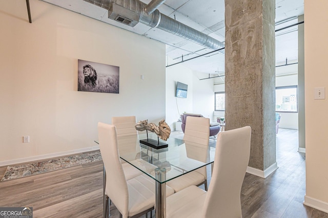 dining space featuring dark hardwood / wood-style flooring