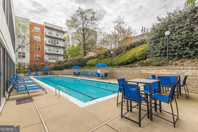 view of swimming pool with a patio