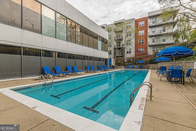 view of pool featuring a patio