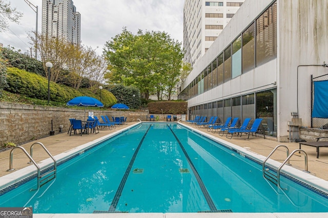 view of pool featuring a patio area