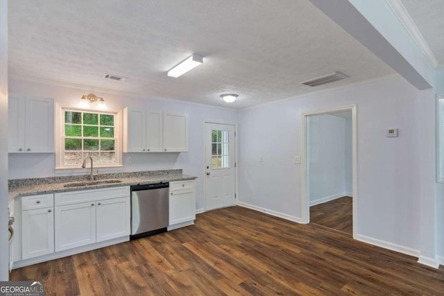 kitchen with dark wood-type flooring, a textured ceiling, dishwasher, white cabinetry, and sink