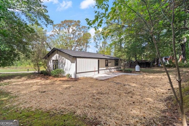 rear view of property featuring a patio area