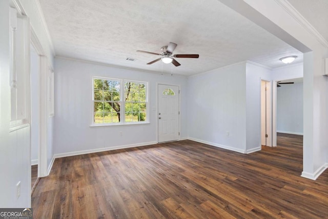 unfurnished room with ceiling fan, dark hardwood / wood-style flooring, and crown molding