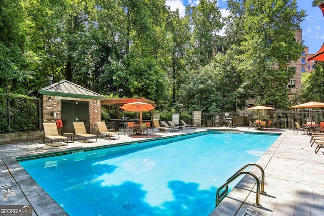 view of pool featuring a patio area