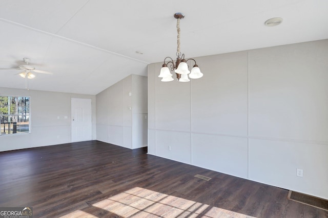 spare room with dark hardwood / wood-style flooring, lofted ceiling, and ceiling fan with notable chandelier