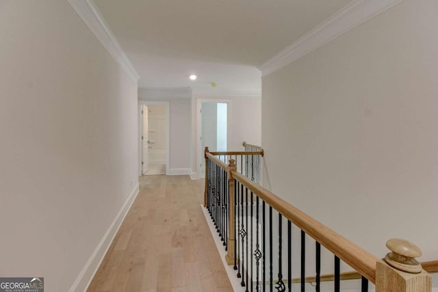 hallway featuring baseboards, crown molding, an upstairs landing, light wood-type flooring, and recessed lighting