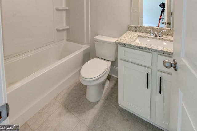 bathroom featuring tile patterned flooring, vanity, toilet, and shower / bathtub combination