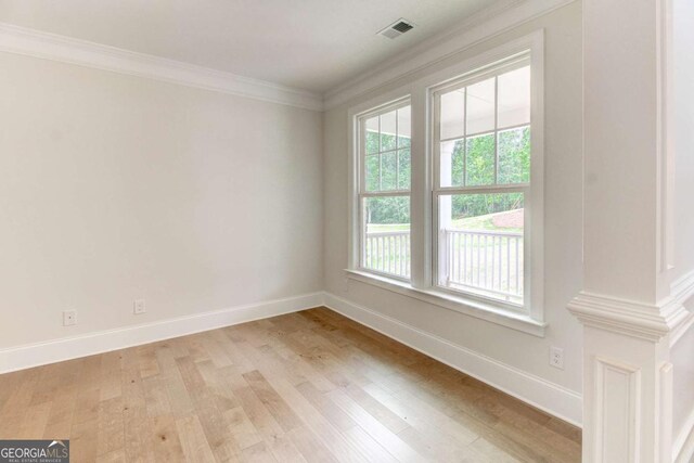 unfurnished living room featuring french doors, ceiling fan, light hardwood / wood-style floors, a tray ceiling, and crown molding