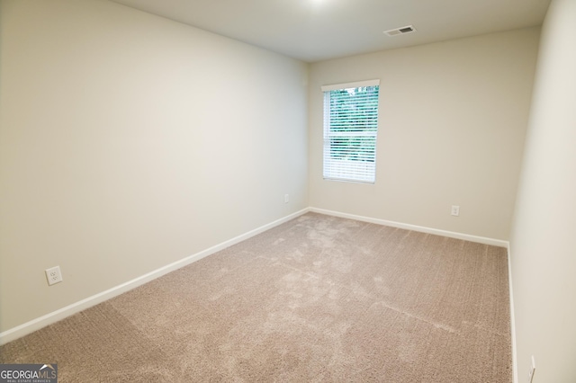 spare room featuring carpet flooring