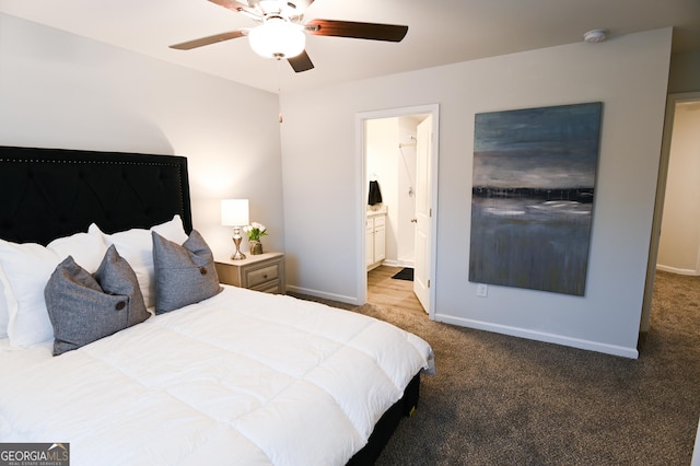 carpeted bedroom with connected bathroom and ceiling fan