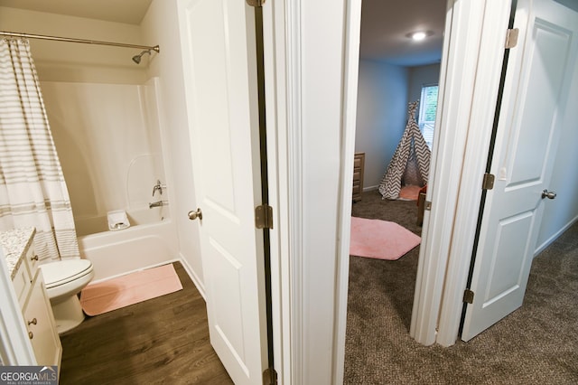 full bathroom with toilet, vanity, shower / bath combo, and hardwood / wood-style floors