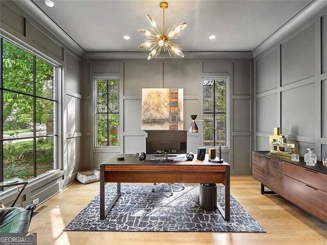 office space featuring a notable chandelier and light hardwood / wood-style flooring