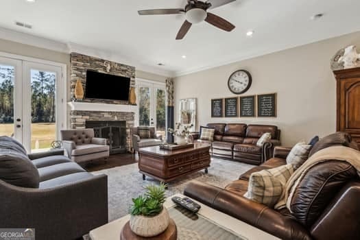 living room with ceiling fan, french doors, and a healthy amount of sunlight