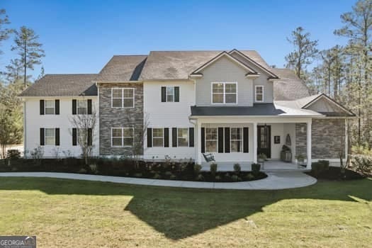 rear view of house with a lawn