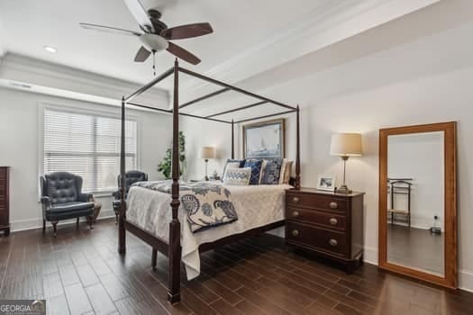 bedroom with ceiling fan and dark wood-type flooring