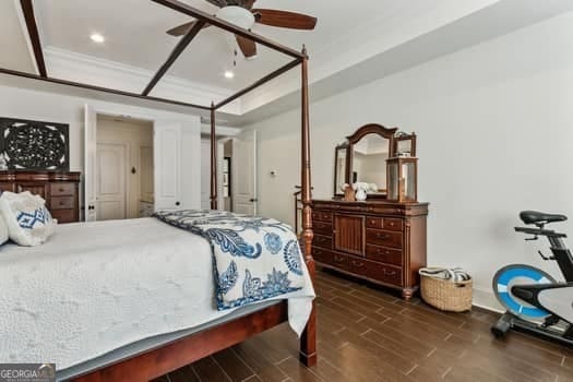 bedroom with ceiling fan and crown molding