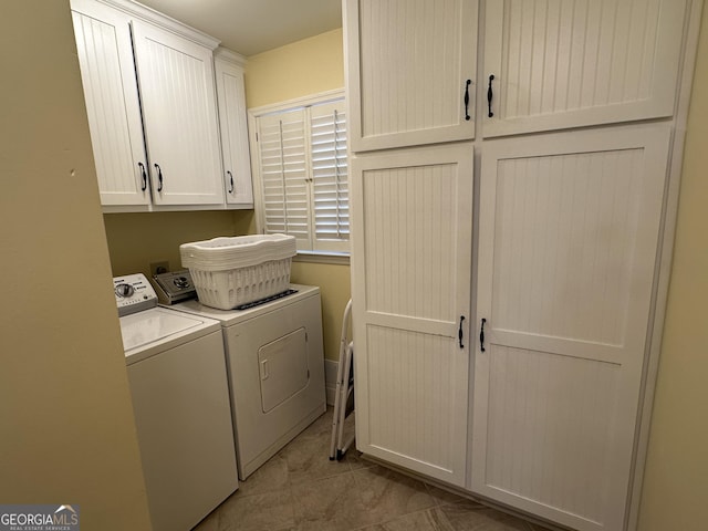 washroom with cabinets and independent washer and dryer