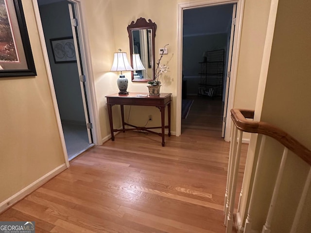 corridor with light hardwood / wood-style flooring