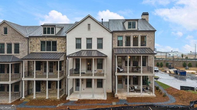 rear view of property featuring a patio area