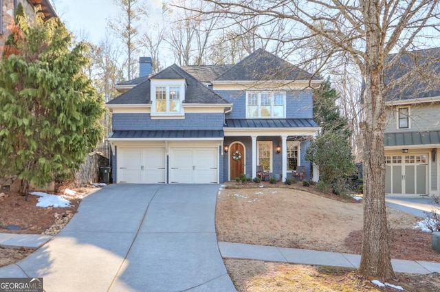 front of property featuring a garage and a porch