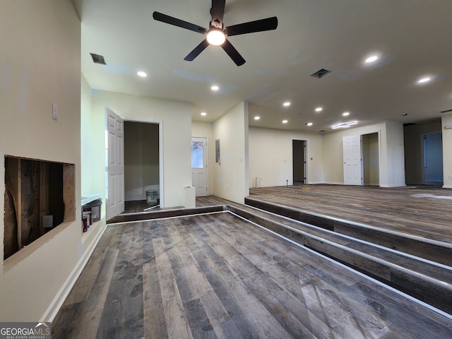 unfurnished living room with hardwood / wood-style floors and ceiling fan