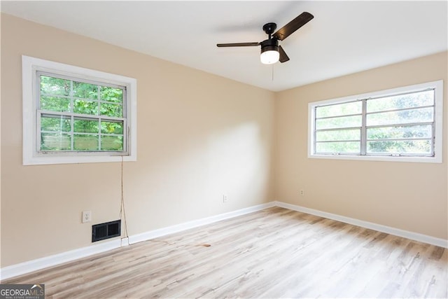 unfurnished room featuring light hardwood / wood-style floors and ceiling fan