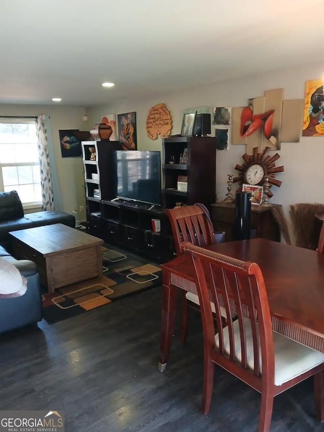 dining area with wood finished floors and recessed lighting