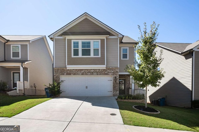 view of front facade with a front yard and a garage