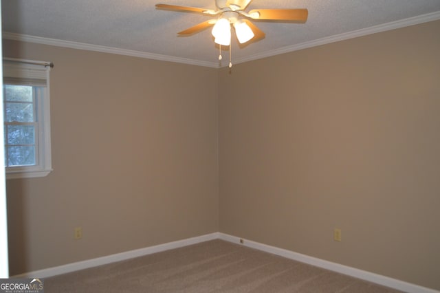 empty room with baseboards, ceiling fan, ornamental molding, and light colored carpet