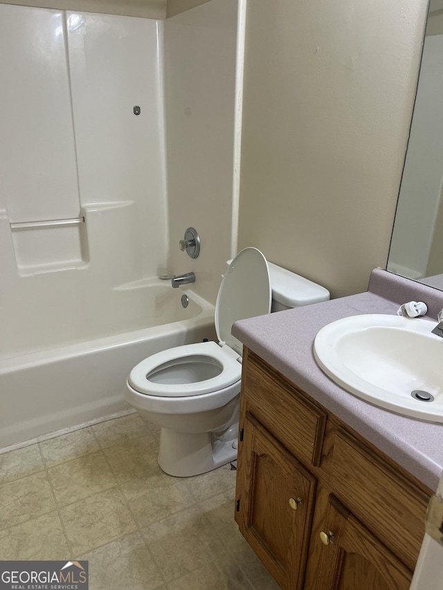 full bathroom with tub / shower combination, vanity, and toilet