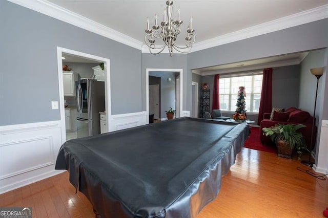 game room featuring ornamental molding, billiards, and wood-type flooring