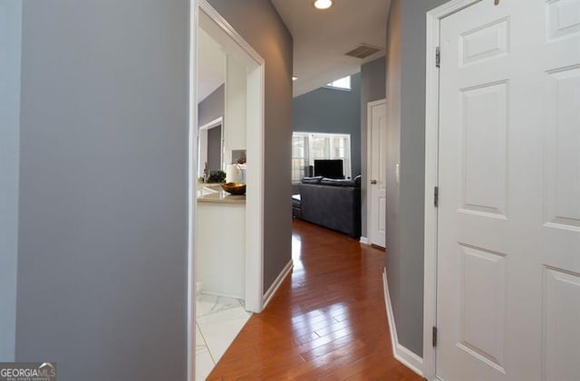 hall with wood-type flooring