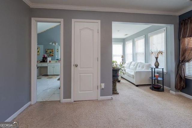 unfurnished living room featuring light colored carpet and crown molding