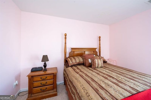 bedroom with light colored carpet