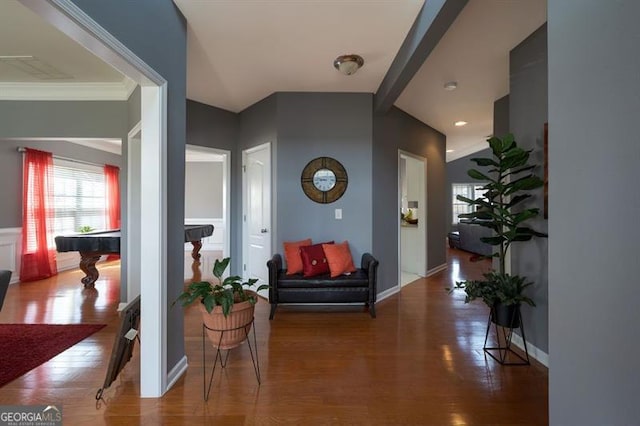 hallway featuring crown molding and wood-type flooring