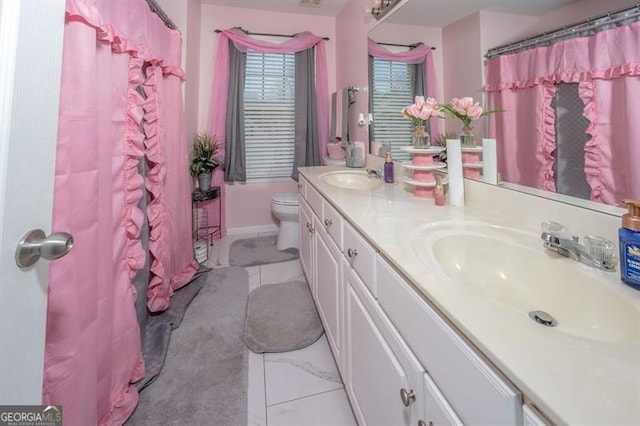 bathroom featuring vanity and toilet