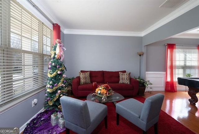 living room with crown molding, billiards, and hardwood / wood-style floors