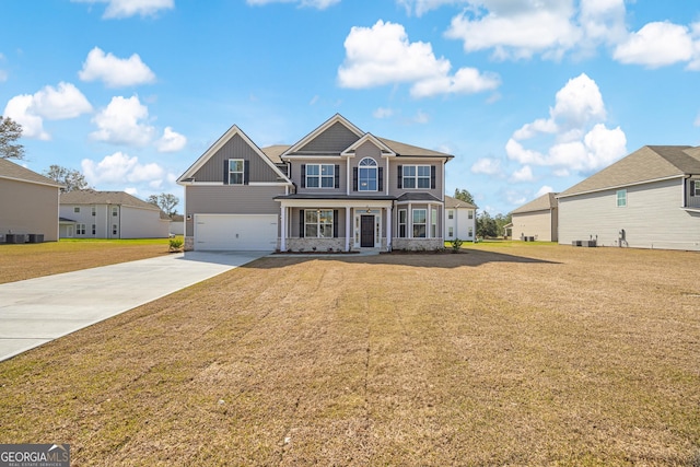 view of front of home featuring a residential view, a front lawn, concrete driveway, and a garage