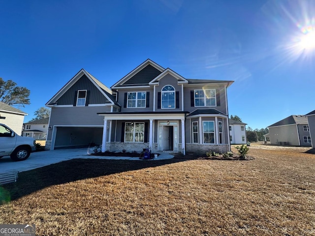 view of front of home featuring a front lawn and a garage