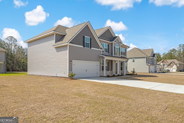 view of front facade with a front lawn, board and batten siding, concrete driveway, and an attached garage