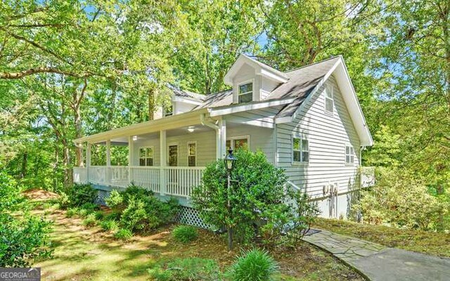 view of home's exterior featuring a porch