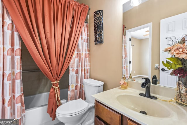 full bathroom with toilet, vanity, and shower / bath combination with curtain