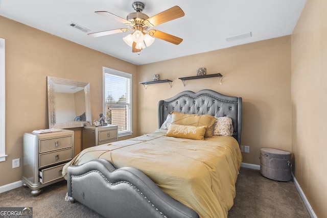 bedroom featuring dark colored carpet and ceiling fan