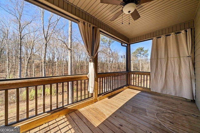 wooden terrace featuring ceiling fan