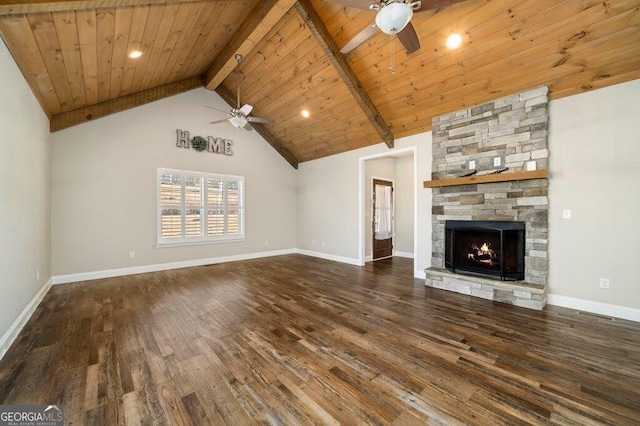 unfurnished living room with beamed ceiling, dark hardwood / wood-style flooring, ceiling fan, wooden ceiling, and a stone fireplace