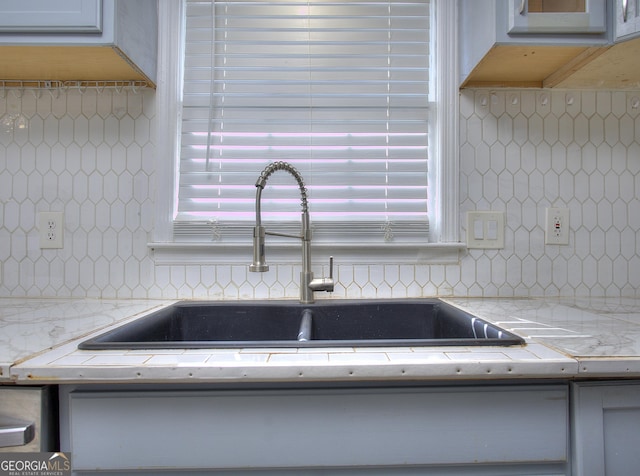 interior details with sink and backsplash