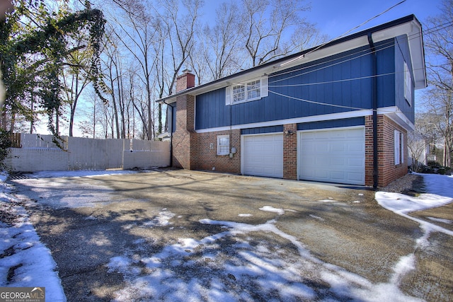 view of side of home with a garage