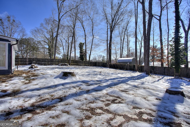 view of yard layered in snow