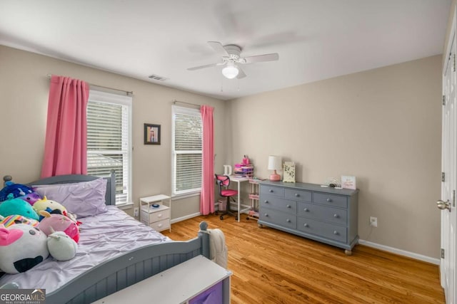 bedroom with ceiling fan and light hardwood / wood-style flooring