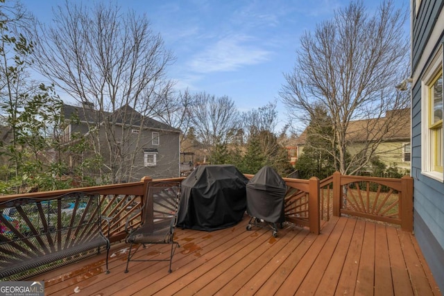 wooden deck with area for grilling